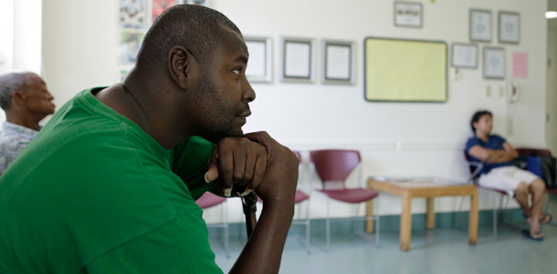 A man waits to see a doctor at a community health center in Miami, Florida. (AP/Lynne Sladky)