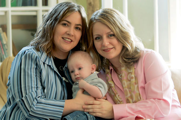 Cari Searcy and Kim McKeand pose with their son. Same-sex adoption was banned in Arkansas in Noember 2008, but an Arkansas state judge struck down the law as unconstitutional earlier this year. (AP/Rob Carr)