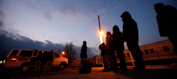 A van picks up homeless men and women in Riverhead, New York. Most shelters around the country either don’t know how or refuse to accommodate the needs of homeless gay and transgender young people. (AP/Seth Wenig)