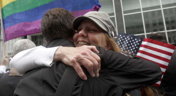 Sheree Red Bornand, right, hugs Aidan Dunn after hearing the decision in the United States District Court proceedings challenging Proposition 8 outside of the Phillip Burton Federal Building in San Francisco on August 4, 2010. (AP/Jeff Chiu)