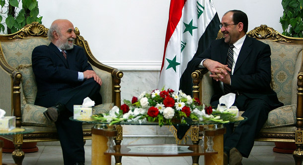 Foud Ajami, left, a Johns Hopkins University professor, meets with Iraqi Prime Minister Nouri al-Maliki in 2007. Ajami's editorials in <i>The Wall Street Journal </i>frequently challenge President Obama's legitimacy. (AP/Wathiq Khuzaie)