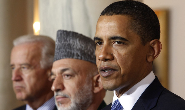 President Barack Obama, accompanied by Vice President Joe Biden, left, and Afghan President Hamid Karzai, makes a statement in the Grand Foyer of the White House after meeting with Karzai last year. (AP/Ron Edmonds)