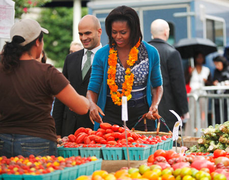 Michelle Obama sets a good example and shops at a farmers' market for local produce near the White House. (AP/Manuel Balce Ceneta)