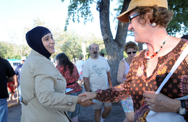Zuleyha Ozonder, left, hands out cards explaining Islam to fairgoers as they exit the Minnesota State Fairgrounds in Falcon Heights, MN. Unfortunately, most Americans say they know little or nothing about Islam. (AP/Dawn Villella)