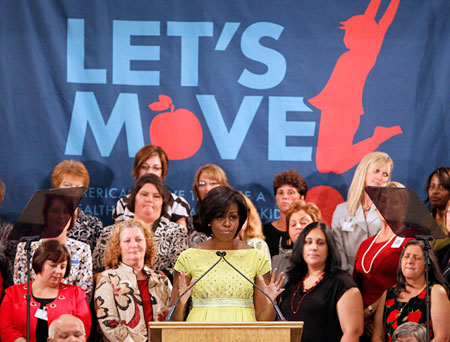Michelle Obama is seen here promoting her Let's Move! campaign at an elementary school in Louisiana. This campaign is an example of recent helpful developments in the fight against childhood obesity but there is still much more that Congress can do, such as passing a new version of the Child Nutrition Act.  (AP/Patrick Semansky)
