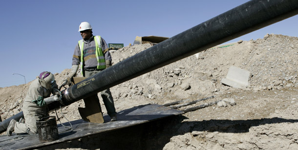 Welders contracted with Southwest Gas Corp. work on a natural gas pipeline in North Las Vegas, Nevada. Coal’s share of electricity generation is declining while the shares of natural gas and renewable energy generation are increasing. (AP/Jae C. Hong)