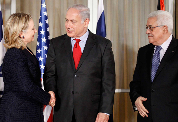 U.S. Secretary of State Hillary Rodham Clinton, left, shakes hands with Israeli Prime Minister Benjamin Netanyahu, center, as Palestinian president Mahmoud Abbas looks on. Israelis and Palestinians launched direct negotiations on September 1  after more than a year of U.S. efforts to bring them to the negotiating  table. (AP/Alex Brandon)
