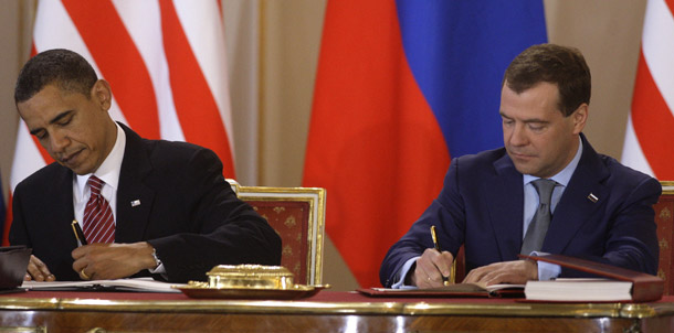 President Barack Obama, left, and his Russian counterpart Dmitry Medvedev, right, sign the New START treaty in Prague, Czech Republic, on April 8, 2010. The Senate Armed Services Committee will soon vote on the treaty, which critics have said limits U.S. missile defense capabilities. (AP/Petr David Josek)