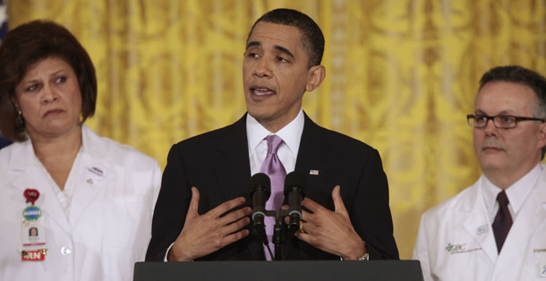 President Barack Obama, flanked by health care professionals Barbara Crane, left, and Stephen Hanson, speaks about health care reform on March 3, 2010, in the East Room of the White House in Washington. (AP/Charles Dharapak)