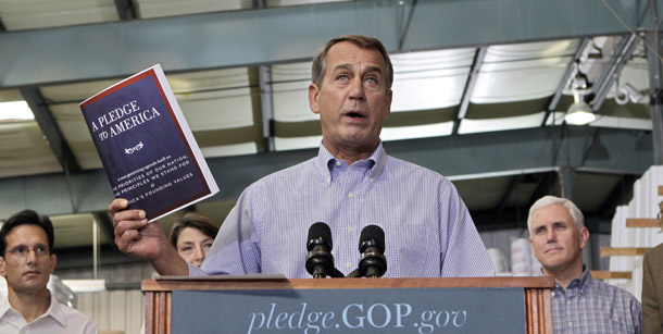 House Minority Leader John Boehner of Ohio holds up a copy of the GOP agenda, "A Pledge to America," on September 23, 2010, at a lumber yard in Sterling, VA. From left are: House Minority Whip Eric Cantor of VA, Rep. Cathy McMorris Rodgers, (R-WA), Boehner, and Rep. Mike Pence, (R-IN). (AP/J. Scott Applewhite)