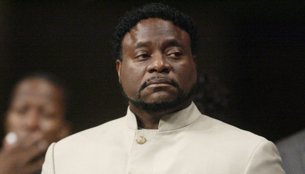 Bishop Eddie Long prepares to speak this past Sunday at New Birth Missionary Baptist Church near Atlanta. Long, the famed pastor of the Georgia megachurch, said that he will fight allegations that he lured young men into sexual relationships, stressing that he'd be back to lead the church the next week. (AP/John Amis)
