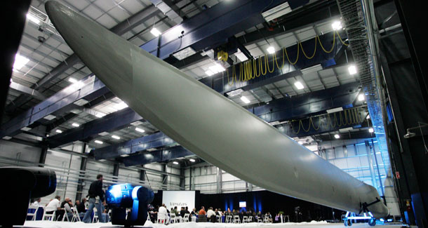 A wind turbine blade is displayed during the opening of the Vestas blade factory in Windsor, CO. The U.S. renewable energy industry created 40,000 jobs because of the Treasury Department's Section 1603 cash grant program. (AP/Jack Dempsey)