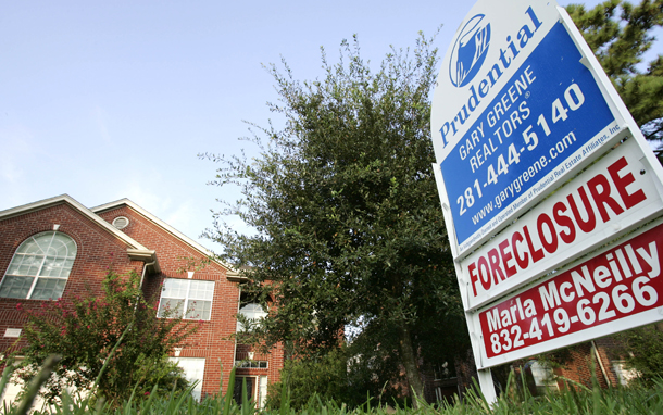 A foreclosure home for sale is shown in Spring, TX. Both judicial and nonjudicial foreclosure states reap the benefits of foreclosure mortgage mediation through faster foreclosures and stable homeownership leading to reduced vacancy, stabilization of property taxes, reduction in vandalism and squatting, and stability in surrounding home values. (AP/David J. Phillip)