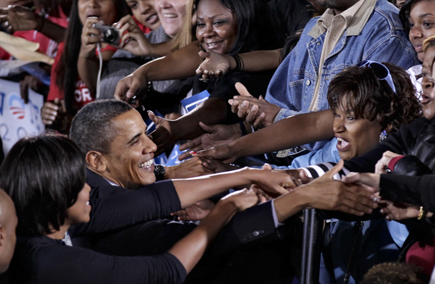 With only two weeks until critical midterm elections, President Barack Obama and First Lady Michelle Obama muster support for Democratic candidates during a rally Sunday at Ohio State University in Columbus, OH. (AP/J. Scott Applewhite)