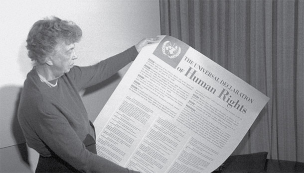 First Lady Eleanor Roosevelt holds a copy of the Universal Declaration of Human Rights. (UN Photo)