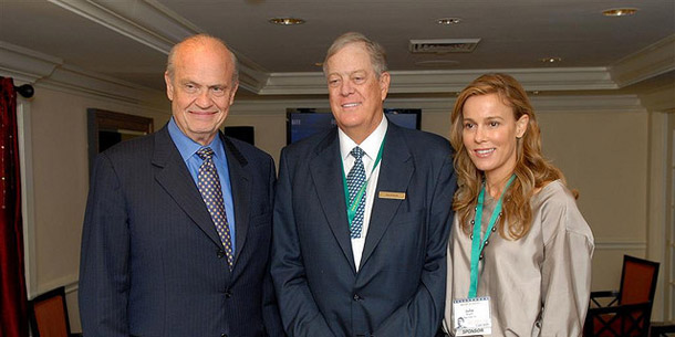 David Koch, center, poses with his wife Julia and Fred Thompson in 2007. Koch funds a vast network of pseudo-scientific organizations to undermine legitimate climate science, and he also funds Tea Party groups that provide foot soldiers to march on behalf of his and his fellow plutocrats’ financial and political interests. (Flickr/<a href=