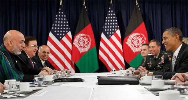 U.S. President Barack Obama, second from right, and Afghanistan President Hamid Karzai, second from left, take part in a bilateral meeting during the NATO Summit in Lisbon, Portugal, on November 20, 2010. The Obama administration should use its upcoming year-end policy review to refocus on the political and diplomatic components of its strategy while it transitions out of Afghanistan. (AP/Pablo Martinez Monsivais)
