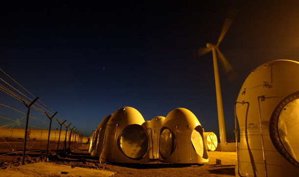 Components of wind turbines lie at a stockyard near the Suzlon Energy factory at Khori in the western Indian state of Maharashtra. (AP/Gautam Singh)