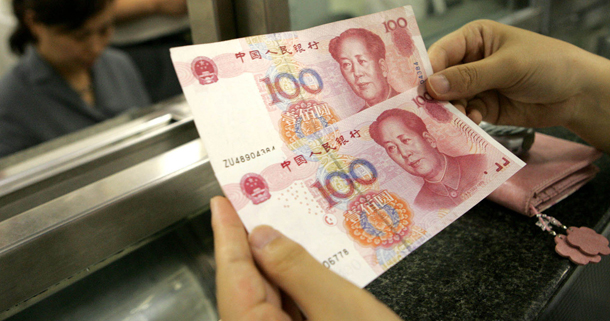 China’s misaligned currency, the renminbi, is introducing distortions into the global financial and trading systems. The United States needs to address this and other imbalances in China, in addition to crafting a new competitiveness strategy and improving competitiveness at home and growing markets abroad. (AP/Ng Han Guan)