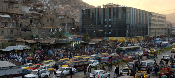 Vehicles and pedestrians crowd the downtown of Kabul, Afghanistan, at dusk. (AP/Musadeq Sadeq)