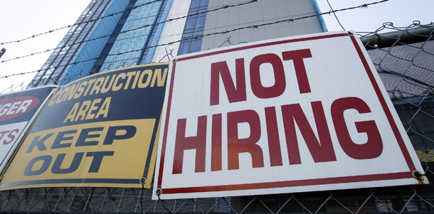 A sign turning away potential job seekers is seen outside of a construction site in New Orleans.  The private sector added 159,000 jobs last month, which is the strongest gain since April. But jobs remain hard to come by and the unemployment rate is stuck at 9.6 percent. (AP/Patrick Semansky)