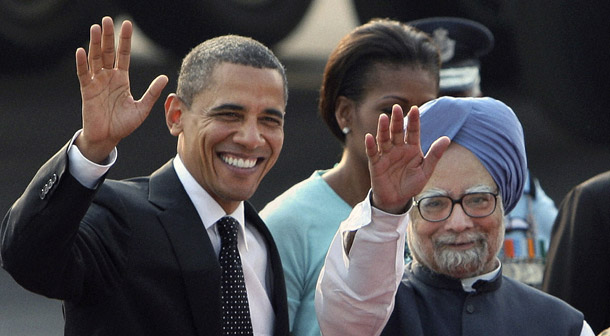 President Barack Obama, left, and Indian Prime Minister Manmohan Singh wave to the media at the airport in New Delhi, India, on November 7, 2010. It is in the United States’ interest to support India’s economic development and its rapid rise in the global economy. (AP)