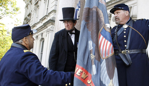Robert F. Costello is dressed as Abraham Lincoln on Monday, October 25, 2010, in Trenton, NJ, as he joins Civil War reenactors in part of the state’s sesquicentennial (150th) observation and commemoration of New Jersey’s part in the Civil War. (AP/Mel Evans)