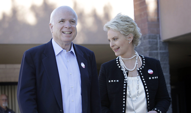 Sen. John McCain (R-AZ) and his wife, Cindy McCain, leave their polling station Tuesday, November 2, 2010, in Phoenix after casting their ballots. (AP/Matt York)