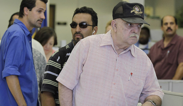 Unemployed people wait in line for information on unemployment insurance and job listings in Las Vegas. (AP/Julie Jacobson)