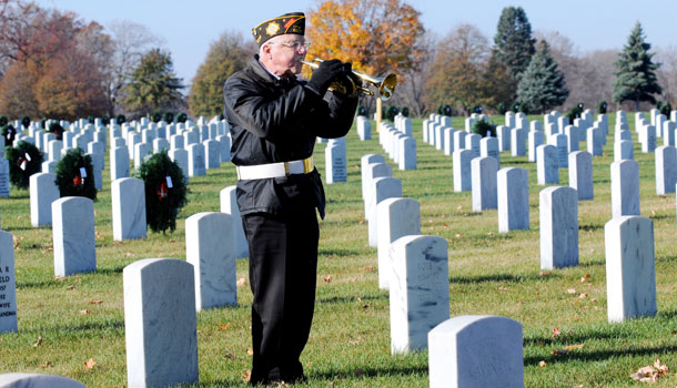 Veteran Tom Mullon, plays Taps during a funeral at the Fort Snelling National Cemetery in Bloomington, Minnesota. (AP/Dawn Villella)