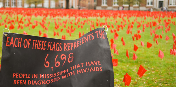 Red flags cover the drill field in a photo provided by Mississippi State University. Each flag represents a Mississippian diagnosed with HIV/AIDS. (AP/MSU, Kenny Billings)