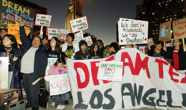 Supporters of the DREAM Act participate in a candlelight procession and vigil in downtown Los Angeles. (AP/Damian Dovarganes)