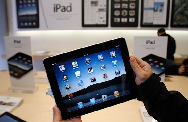 An Apple iPad is PVC-free, and it has arsenic-free glass, a mercury-free LED display, and an outer case of recyclable aluminum and glass. (AP/Paul Sakuma)