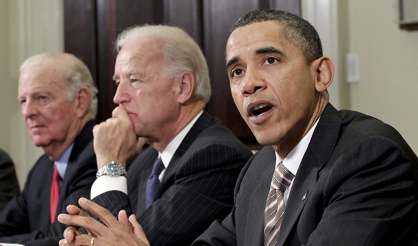 President Barack Obama, right, drops by a meeting hosted by Vice President Joe Biden, center, on New START in the Roosevelt Room at the White House in Washington, Thursday, November 18, 2010.
<br /> (AP/J. Scott Applewhite)