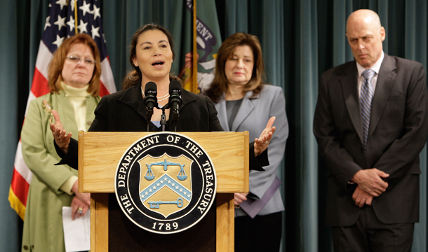Former U.S. Treasurer Anna Cabral, second from left, speaks about the Earned Income Tax Credit as part of EITC Awareness Day. The Treasury Department distributed $50 billion to low- and moderate-income families through the EITC program last year, but the government estimates that about a quarter of those payments were deemed improper. (AP/Ron Edmonds)