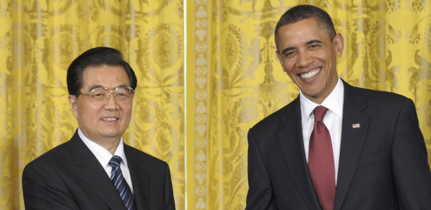 President Barack Obama and China's President Hu Jintao shake hands after their joint news conference on January 19, 2011. The deals cut on clean energy among U.S. and Chinese companies are a positive step, but the United States needs to strengthen and enact clean energy policies to remain competitive in this emerging worldwide market and boost domestic economic growth. (AP/Susan Walsh)