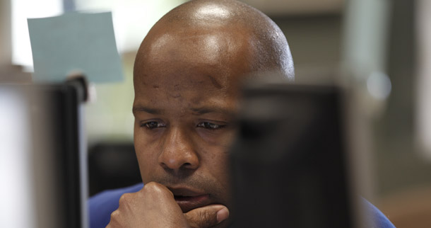 Raymone Davis of Vista, CA, checks for jobs at a career development center in Oceanside, CA, on January 6, 2011. Last month's job gains were concentrated in low-wage, low-productivity industries, frustrating job seekers. (AP/Gregory Bull)