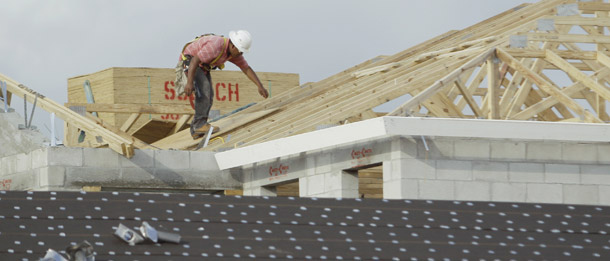 A roofer works on a house in the planned community of Monterra, in Cooper City, FL, January 18, 2011. Policymakers have to focus on jobs, especially for groups seeing extraordinarily high unemployment such as communities of color, young job entrants, and people with little educational attainment. (AP/J Pat Carter)