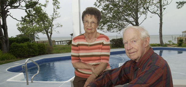 Retirees Jim and Evelyn Burke pose at their Gulf Breeze, FL home. The tax code encourages people to save for retirement by allowing them to shelter from taxes personal income invested in 401(k) plans, individual retirement accounts, or IRAs, employer pension plans, and other similar savings vehicles. (AP/Tony Giberson)