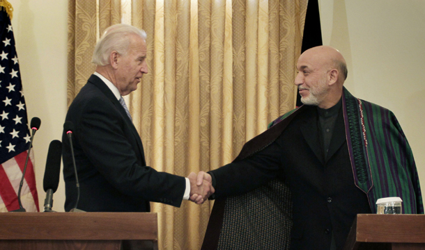 Afghan President Hamid Karzai, right, shakes hands with U.S. Vice President Joe Biden during a press conference in Kabul, Afghanistan, on Tuesday, January 11, 2011. (AP/Musadeq Sadeq)