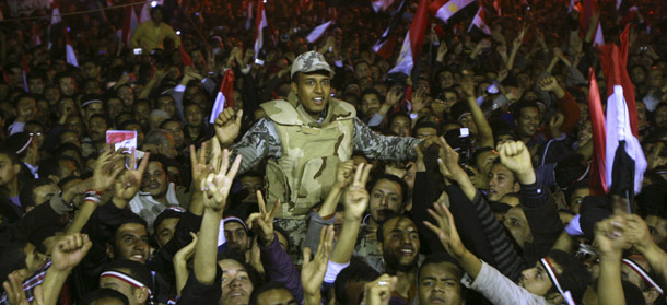 Egyptians celebrate in Tahrir Square after  President Hosni Mubarak resigned in Cairo, Egypt, on February 11, 2011. The United States can play a critical role in fostering economic growth  in Egypt to create jobs and thus more hope for millions of Egyptians. (AP/Ahmed Ali)