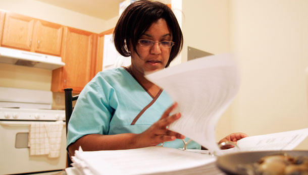 Aja Holmes studies for her online college classes at The University of Phoenix. (AP/Jim R. Bounds)