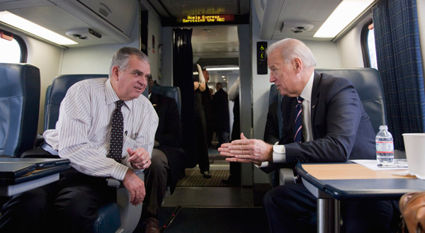 Vice President Joe Biden talks with Transportation Secretary Ray LaHood on a train heading to an event to tout plans to improve the nation's infrastructure. Biden’s announcement of a far-reaching high speed rail plan shows that the Obama administration is on the right track when it comes to budget priorities and how to use federal dollars more wisely. (AP/Evan Vucci)
