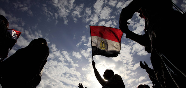 Egyptian anti-Mubarak protesters chant as they wave Egyptian flags during their protest in Cairo, Egypt. The Egyptian revolution is reigniting arguments against land-for-peace being the basis for Arab-Israeli peace agreements. (AP/Amr Nabil)