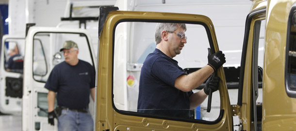 Workers install seals on a door frame on the Volvo truck assembly line at the Volvo plant in Dublin, Virginia. Productivity growth for the first 12 quarters of this business cycle, from December 2007 to December 2010, totaled 7.6 percent, below the average of 8.5 percent for the previous eight business cycles lasting at least three years. (AP/Steve Helber)