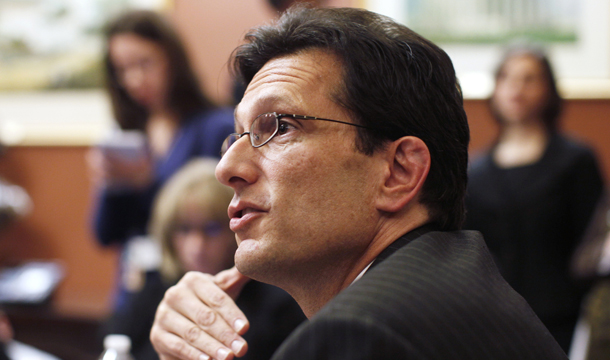 House Majority Leader Eric Cantor (R-VA), pictured above, speaks to reporters on Capitol Hill in Washington. Cantor mustered the forces of the “total crazies” to countermand  Budget Committee Chairman Paul Ryan (R-WI) and direct the Appropriations Committee to produce an additional $26 billion in budget cuts.
<br /> (AP/Charles Dharapak)