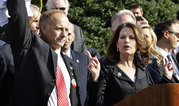 Conservatives such as Reps. Steve King (R-IA), left, and Michele Bachmann (R-MN), right, claim that $105 billion of mandatory funding was secretly put in the Affordable Care Act unbeknownst to members of Congress. This is false. Conservatives often push myths and misconceptions of the health reform law as a way to increase opposition. (AP/Alex Brandon)