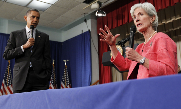 President Barack Obama listens as Health and Human Services Secretary Kathleen Sebelius speaks during a town hall meeting on the Affordable Care Act, Tuesday, June 8, 2010, at the Holiday Park Multipurpose Senior Center in Wheaton, MD. (AP/Alex Brandon)