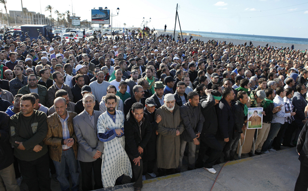 Hundreds of Libyans perform funeral prayers for people who have been killed recently in Tripoli, Libya, Sunday, March 20, 2011. (AP)