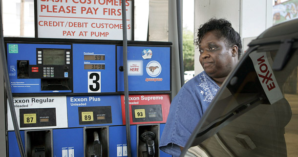 A woman puts gas in her Ford Explorer at an Exxon station in Harrisburg, Pennsylvania. Over the past month oil prices rose by over $20 per barrel, or more than 25 percent. (AP/Carolyn Kaster)